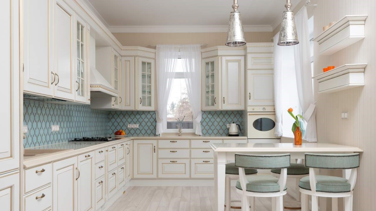 This is an image of a kitchen with a beautiful wall paint.